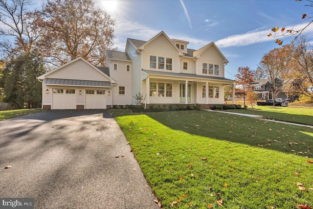 front facade with a porch and a front yard