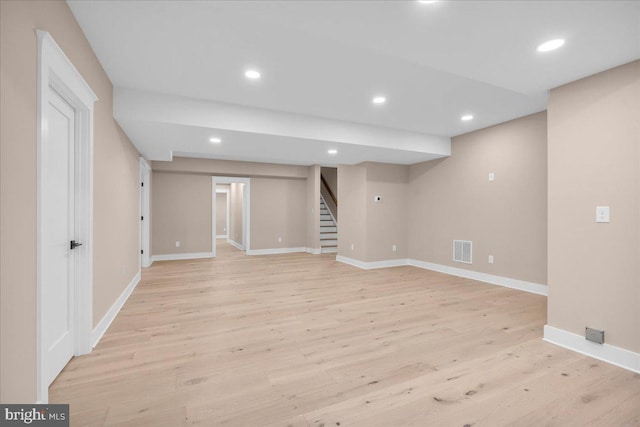 basement featuring light wood-type flooring