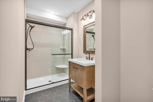 bathroom featuring vanity, tile patterned floors, and an enclosed shower