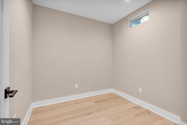 unfurnished room with hardwood / wood-style floors