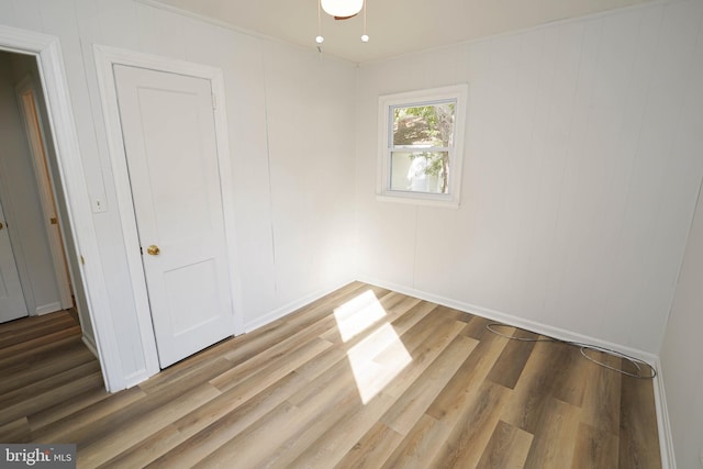 spare room featuring wood-type flooring