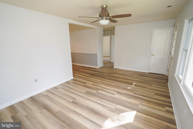 unfurnished room featuring ceiling fan and light hardwood / wood-style floors