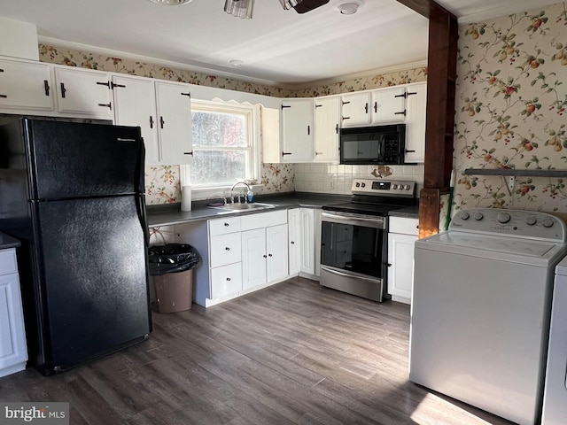 kitchen with washer / dryer, sink, white cabinets, dark hardwood / wood-style flooring, and black appliances