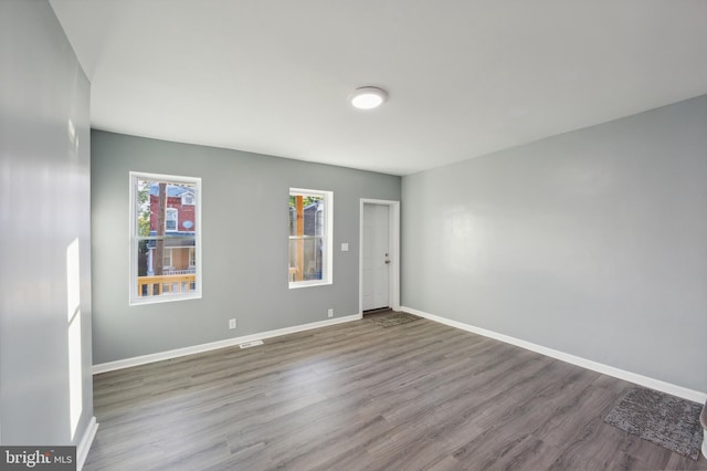 unfurnished room featuring hardwood / wood-style floors