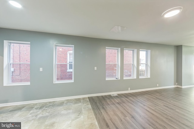 unfurnished room featuring light wood-type flooring