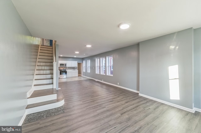 unfurnished living room with light hardwood / wood-style flooring