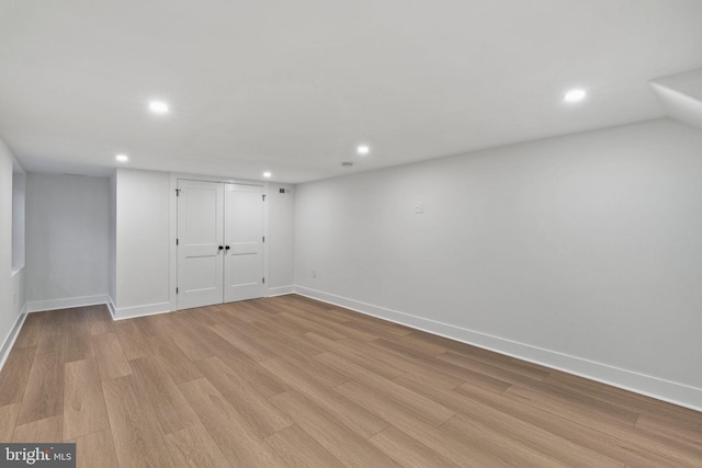 basement featuring light hardwood / wood-style flooring