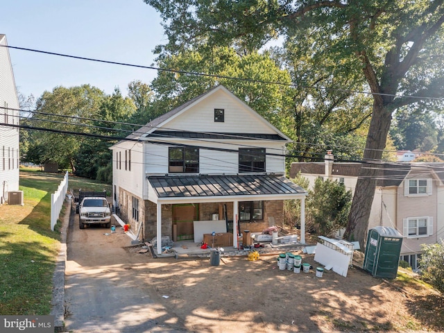 view of front facade with central AC unit and covered porch