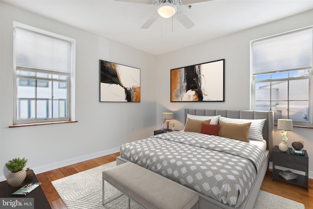 bedroom featuring hardwood / wood-style floors and ceiling fan