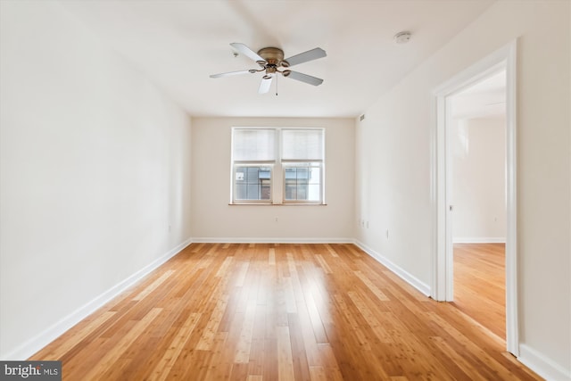 unfurnished room featuring ceiling fan and light hardwood / wood-style floors