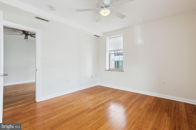 unfurnished room with wood-type flooring and ceiling fan