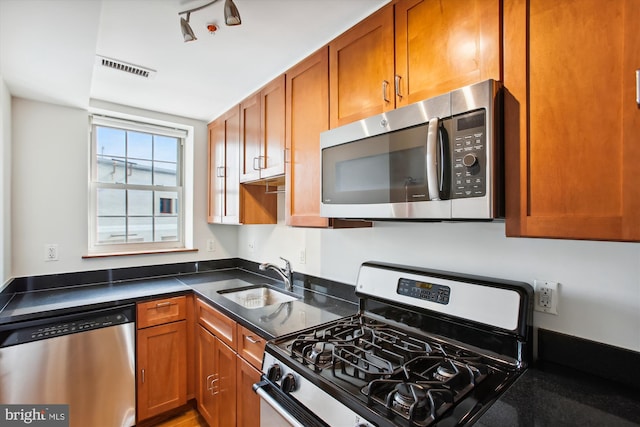 kitchen featuring stainless steel appliances and sink