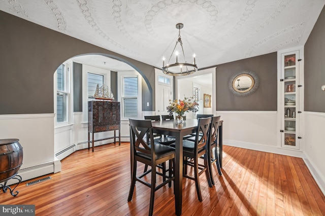 dining room featuring a chandelier and hardwood / wood-style flooring