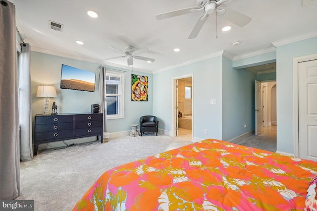 bedroom featuring ceiling fan, ornamental molding, light carpet, and ensuite bath