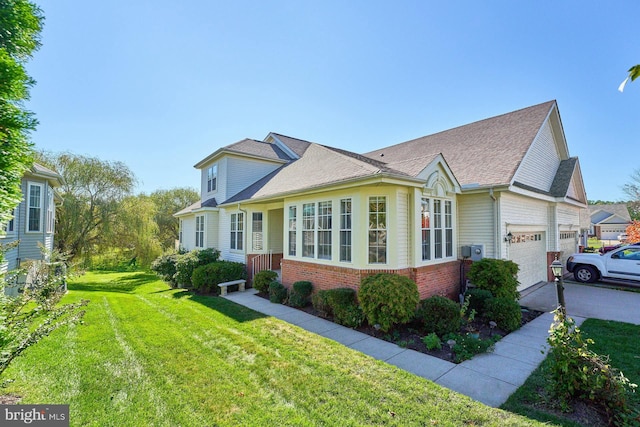 view of front facade with a front lawn and a garage