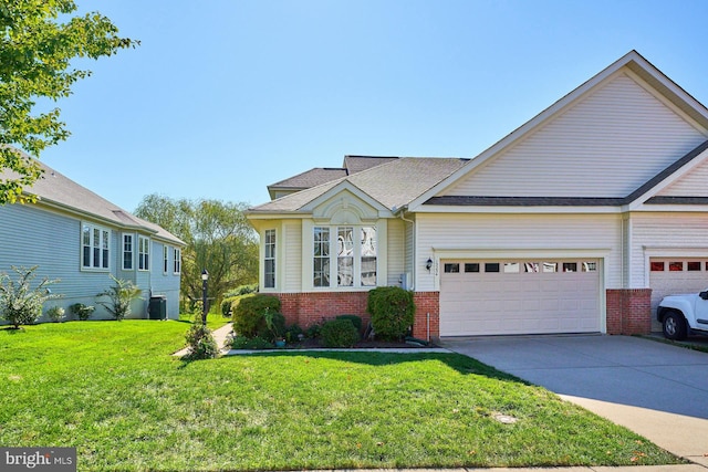 view of front of home featuring central air condition unit, a front lawn, and a garage