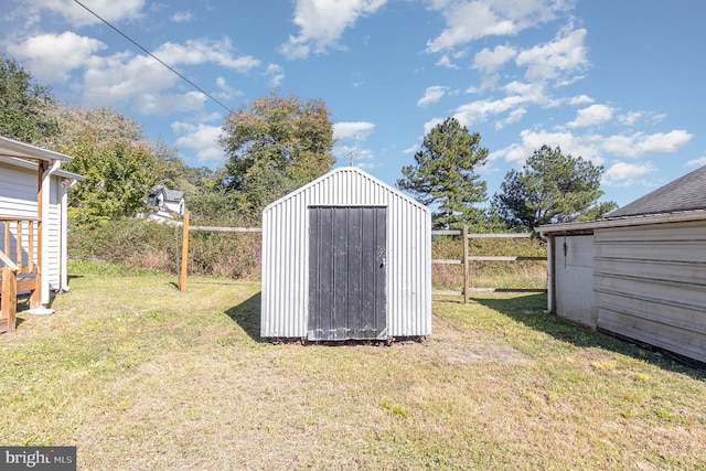 view of outdoor structure featuring a lawn