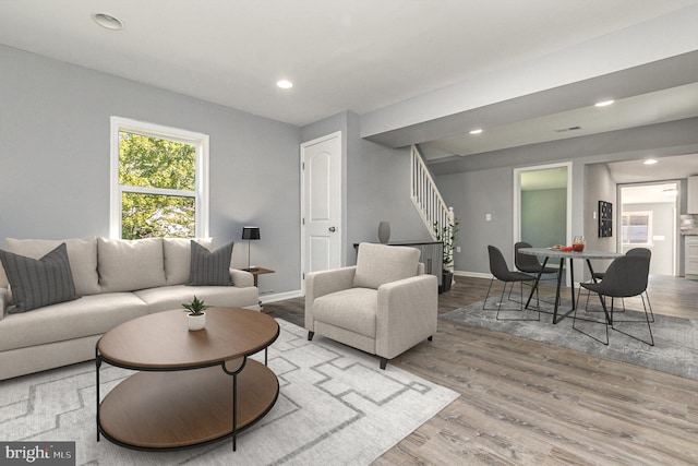 living room with light hardwood / wood-style floors