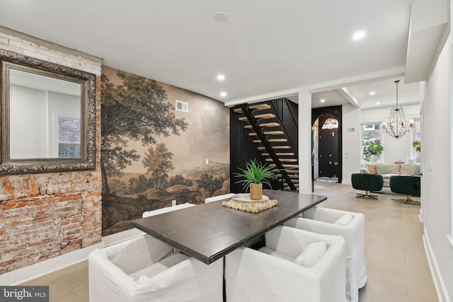 dining space featuring an inviting chandelier