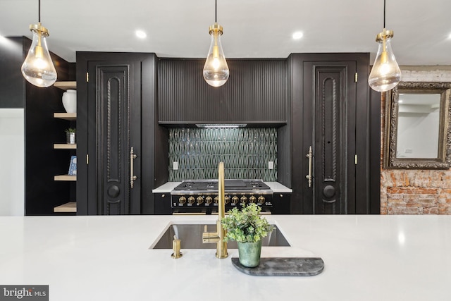 kitchen with pendant lighting and stainless steel range