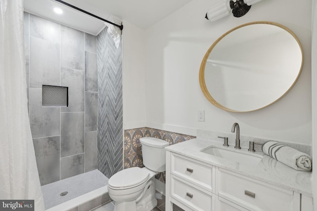 bathroom with vanity, a shower with shower curtain, and toilet