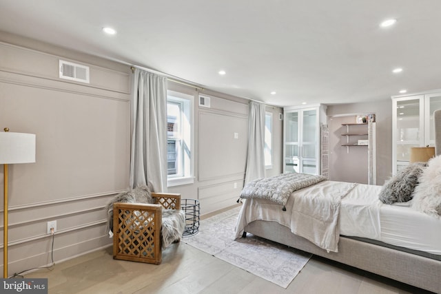 bedroom with light wood-type flooring