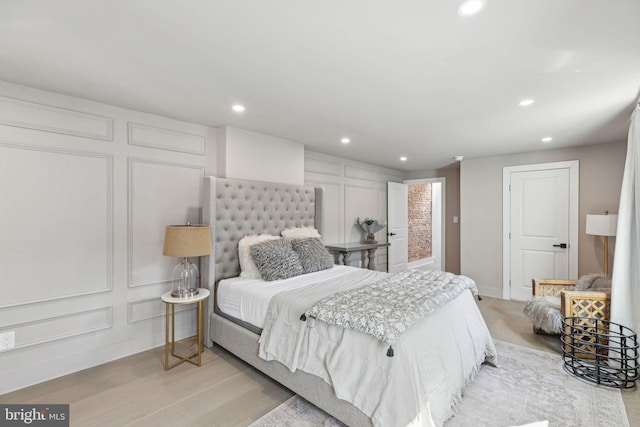 bedroom with light wood-type flooring