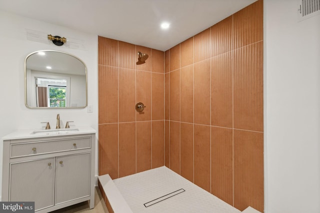 bathroom with vanity and walk in shower