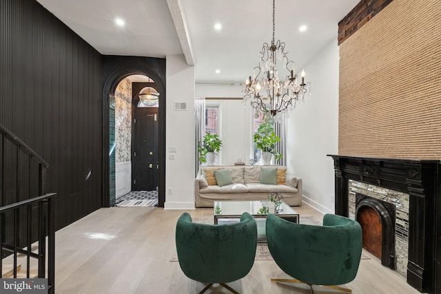 interior space featuring a fireplace and an inviting chandelier