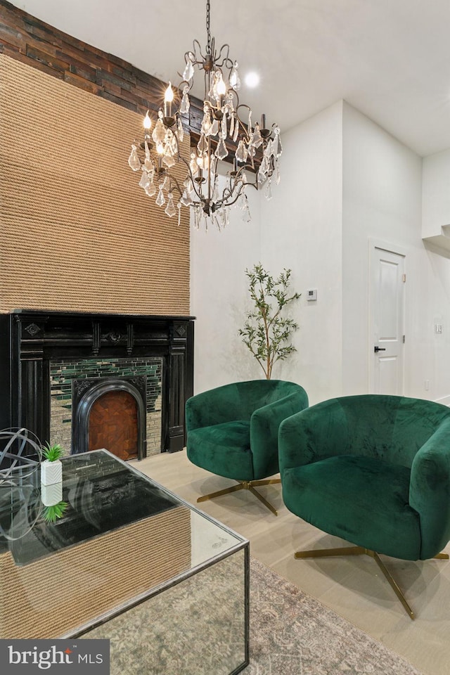 living room featuring a fireplace and an inviting chandelier