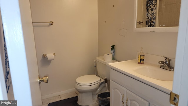 bathroom featuring vanity, toilet, and tile patterned floors