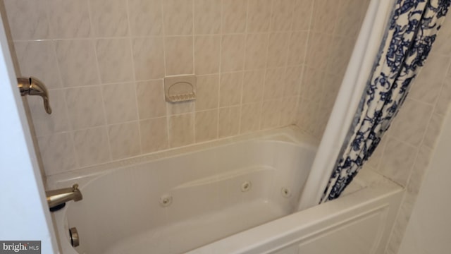 bathroom featuring shower / bathtub combination with curtain