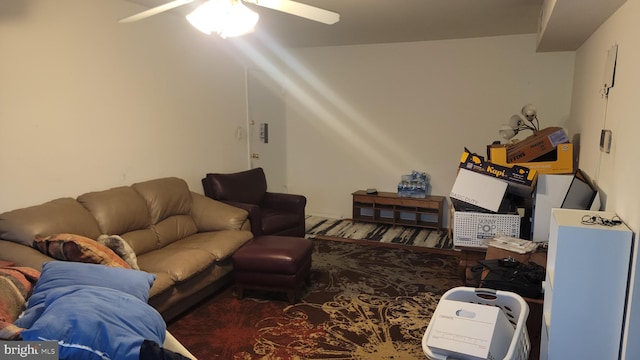 carpeted living room featuring ceiling fan