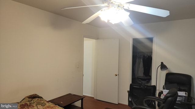 bedroom featuring a closet, ceiling fan, and dark hardwood / wood-style floors