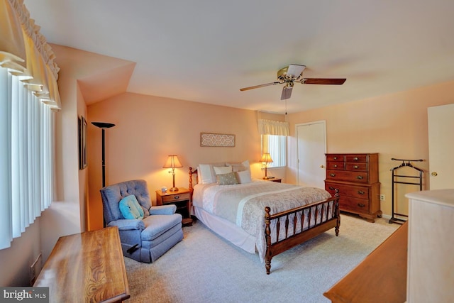 bedroom with ceiling fan and light carpet