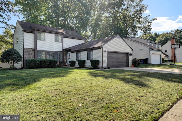 view of front of house featuring a garage and a front lawn