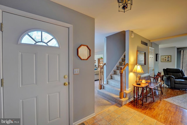 foyer entrance with light hardwood / wood-style flooring