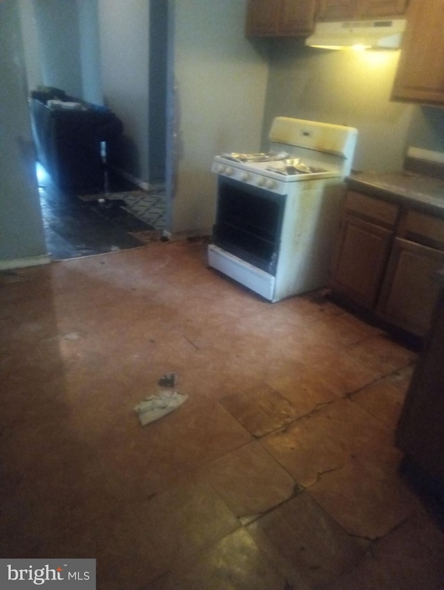 kitchen with white gas range oven