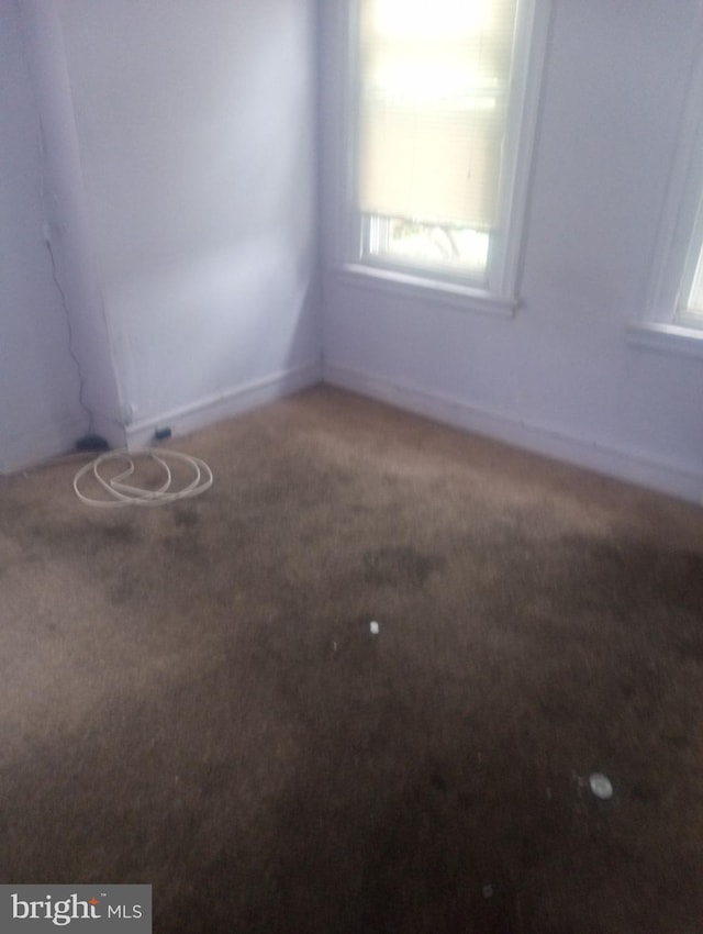 empty room with carpet flooring