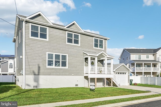 view of front of property with a garage, a porch, and a front lawn