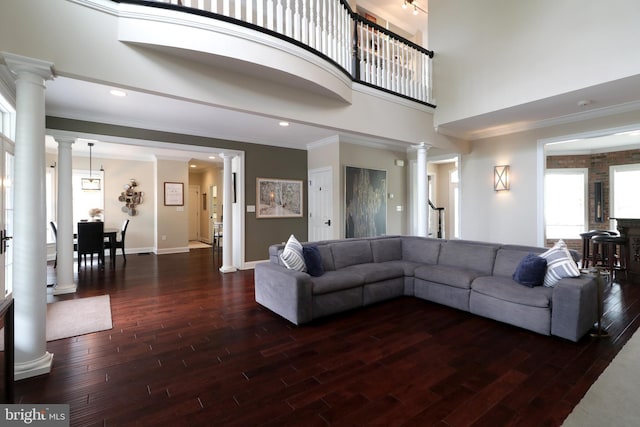 living room featuring dark hardwood / wood-style floors and ornamental molding