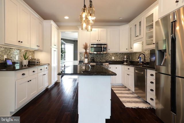 kitchen featuring white cabinetry, a kitchen island, and stainless steel appliances