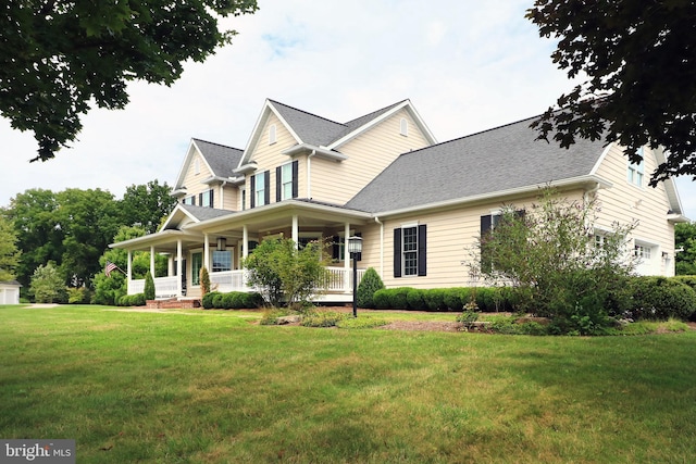 view of front of house with a front lawn and covered porch