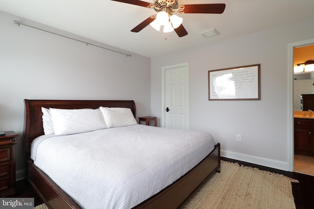 bedroom featuring ensuite bathroom and ceiling fan