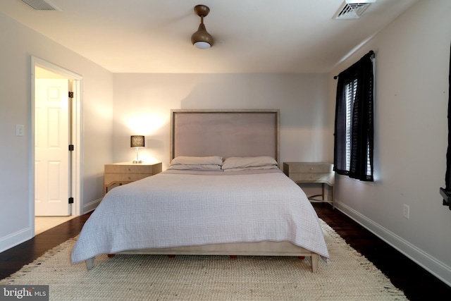 bedroom featuring ceiling fan and dark hardwood / wood-style floors