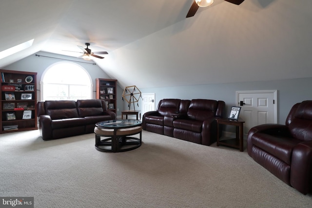 carpeted living room featuring ceiling fan and lofted ceiling