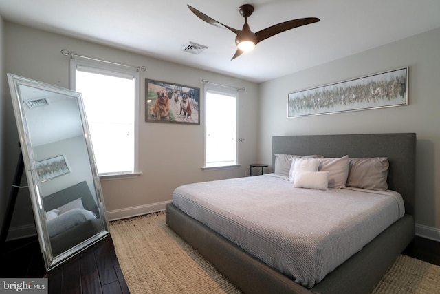 bedroom featuring hardwood / wood-style floors and ceiling fan