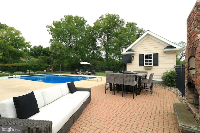 view of swimming pool featuring a patio area and an outdoor hangout area