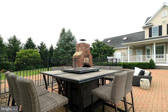 view of patio / terrace featuring exterior fireplace