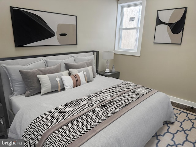 bedroom with wood-type flooring